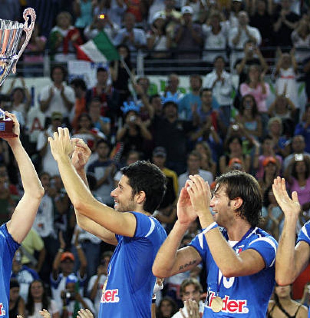 ROME, Italy:  Italy's captain Valerio Vermiglio (L) holds the cup in front of his teammates (from L) Alberto Cisolla, Luca Tencati, Cristian Savani  after defeating Russia during the volley men's european championship final at Palalottomatica stadium in Rome, 11 September 2005. AFP PHOTO / PACO SERINELLI  (Photo credit should read PACO SERINELLI/AFP via Getty Images)